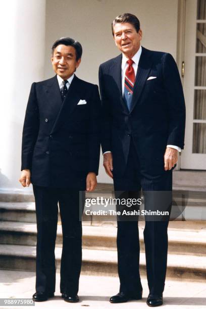 Crown Prince Akihito and U.S. President Ronald Reagan pose for photographs at the Rose Garden of the White House on October 6, 1987 in Washington, DC.