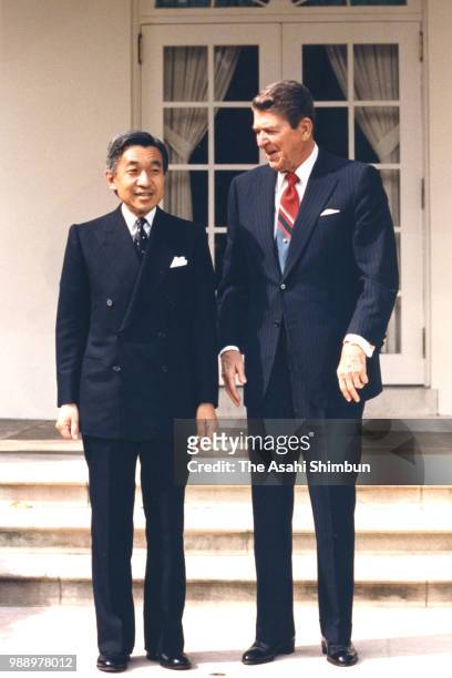 Crown Prince Akihito and U.S. President Ronald Reagan pose for photographs at the Rose Garden of the White House on October 6, 1987 in Washington, DC.