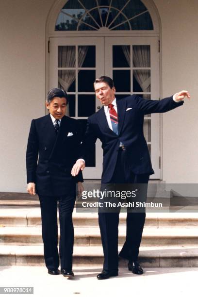 President Ronald Reagan loses his balance prior to the photo session with Crown Prince Akihito at the Rose Garden of the White House on October 6,...