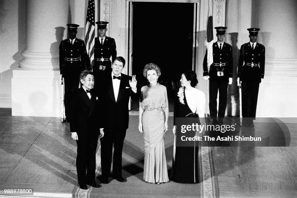 Crown Prince Akihito and Crown Princess Michiko are welcomed by U.S. President Ronald Reagan and his wife Nancy prior to their dinner at the White...