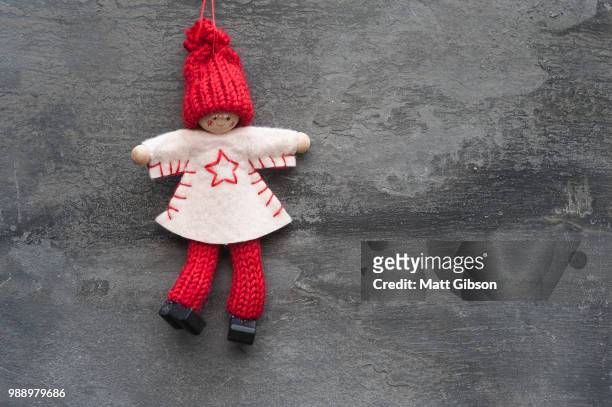 generic machine made christmas peg dolly ornament on rustic styl - peg stock pictures, royalty-free photos & images