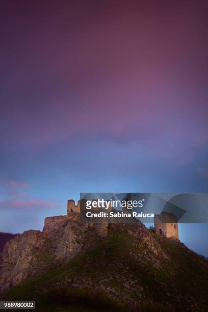 sunrise rays over the old citadel - romanian ruins stockfoto's en -beelden