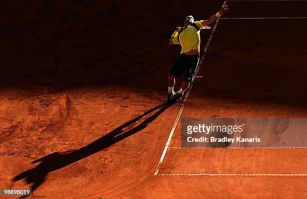 Lleyton Hewitt of Australia serves during his match against Totsuma Ito of Japan during the match between Australia and Japan on day one of the Davis...