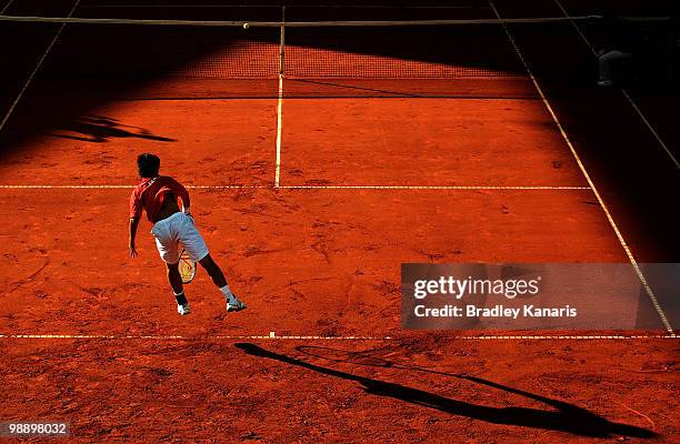 Totsuma Ito of Japan serves during his match against Lleyton Hewitt of Australia during the match between Australia and Japan on day one of the Davis...