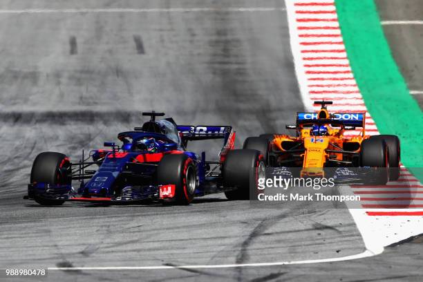 Brendon Hartley of New Zealand driving the Scuderia Toro Rosso STR13 Honda leads Fernando Alonso of Spain driving the McLaren F1 Team MCL33 Renault...