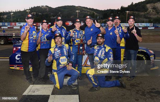 Derek Kraus celebrates with his crew after winning the Clint Newell Toyota 150 presented by NAPA Auto Parts for the NASCAR K&N West Series at the...