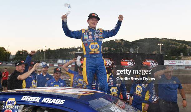 Derek Kraus celebrates with his crew after winning the Clint Newell Toyota 150 presented by NAPA Auto Parts for the NASCAR K&N West Series at the...