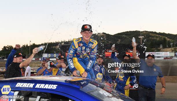 Derek Kraus celebrates with his crew after winning the Clint Newell Toyota 150 presented by NAPA Auto Parts for the NASCAR K&N West Series at the...