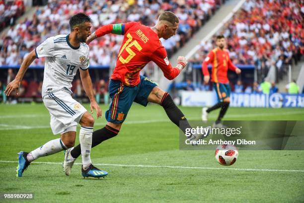 Aleksander Samedov of Russia and Sergio Ramos of Spain during the FIFA World Cup Round of 26 match between Spain and Russia at Luzhniki Stadium on...