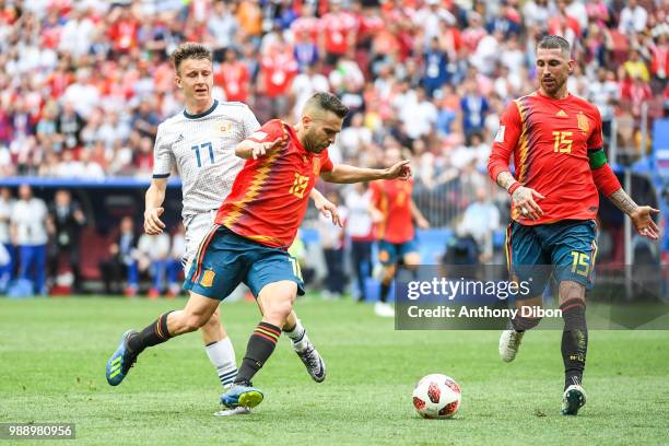 Aleksandr Golovin of Russia, Jordi Alba of Spain and Sergio Ramos of Spain during the FIFA World Cup Round of 26 match between Spain and Russia at...
