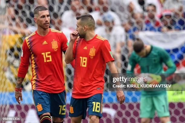 Spain's defender Sergio Ramos and Spain's defender Jordi Alba chat during the Russia 2018 World Cup round of 16 football match between Spain and...