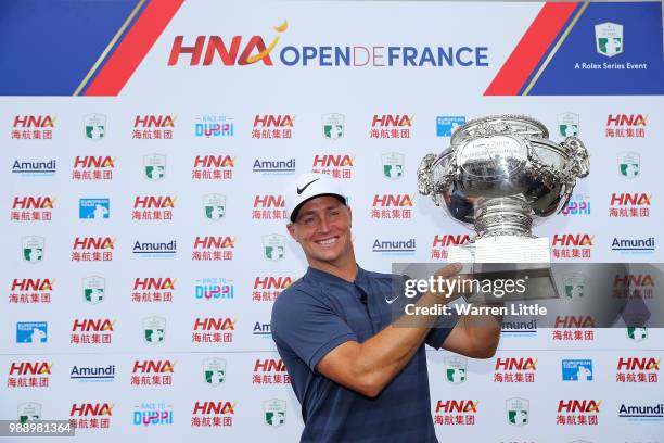 Alex Noren of Sweden celebrates with the trophy following day four of the HNA Open de France at Le Golf National on July 1, 2018 in Paris, France.