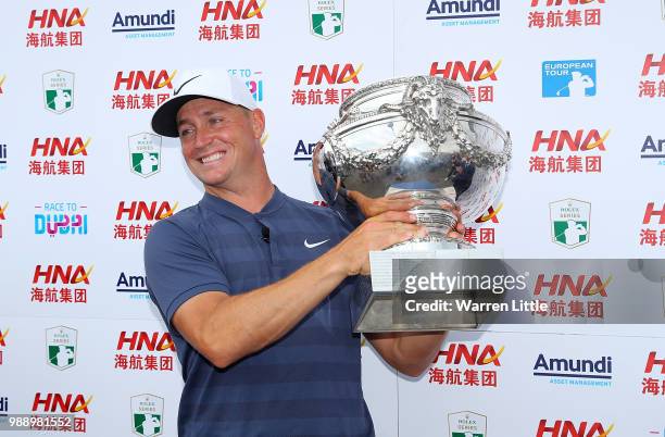 Alex Noren of Sweden celebrates with the trophy following day four of the HNA Open de France at Le Golf National on July 1, 2018 in Paris, France.