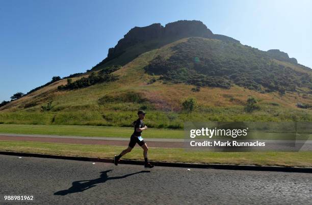 An Athlete competes in the run leg inside Holyrood Park during the IRONMAN 70.3 Edinburgh Triathlon on July 1, 2018 in Edinburgh, Scotland.