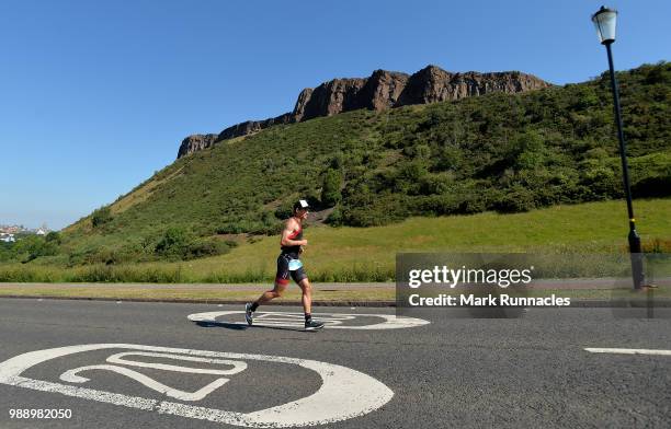 An Athlete competes in the run leg inside Holyrood Park during the IRONMAN 70.3 Edinburgh Triathlon on July 1, 2018 in Edinburgh, Scotland.