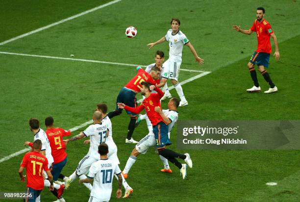 Gerard Pique, Sergio Ramos and Rodrigo of Spain battle with the Russia players in the box during the 2018 FIFA World Cup Russia Round of 16 match...