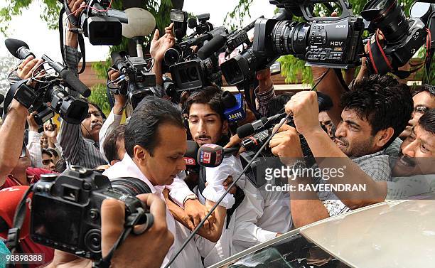 Reliance Dhirubhai Group Chairman Anil Ambani leaves the Supreme Court in New Delhi on May 7 after hearing judgements in a legal dispute involving...