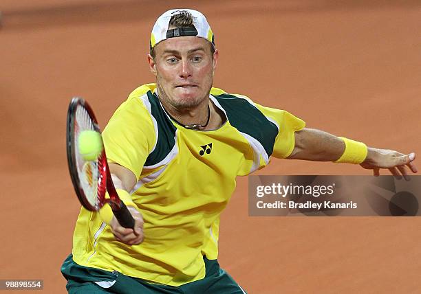 Lleyton Hewitt of Australia plays a forehand during his match against Tatsuma Ito of Japan during the match between Australia and Japan on day one of...