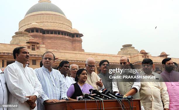 Senior Bharatiya Janata Party Leader and Leader of Opposition Sushma Swaraj is watched by fellow party senior leaders as she addresses the media at...