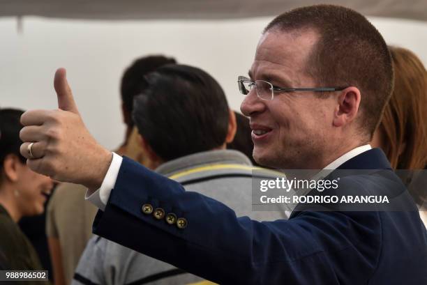 Mexico's presidential candidate Ricardo Anaya for the "Mexico al Frente" coalition party, gives his thumb up during general elections, in Queretaro,...