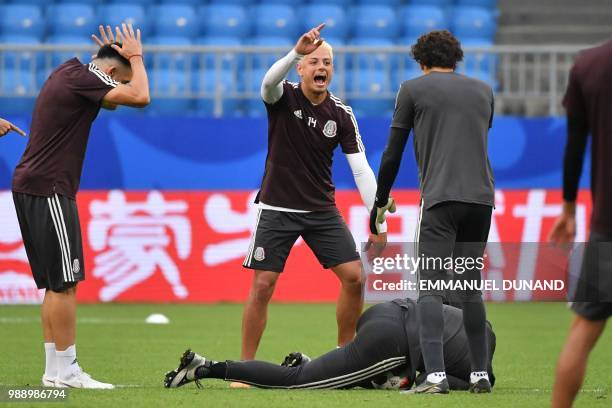 Mexico's midfielder Hector Herrera and forward Javier Hernandez take part to a training session at the Samara Arena stadium on the eve of the Russia...