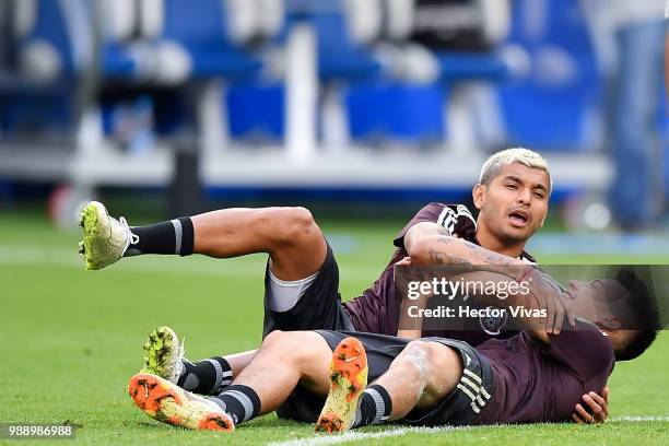 Jesus Manuel Corona and Hirving Lozano of Mexico, hug during a training at Samara Arena ahead of the Round of Sixteen match against Brazil on July 1,...