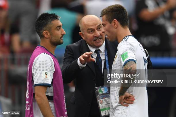 Russia's coach Stanislav Cherchesov gives instructions to Russia's forward Fedor Smolov and Russia's midfielder Alexander Samedov during the Russia...