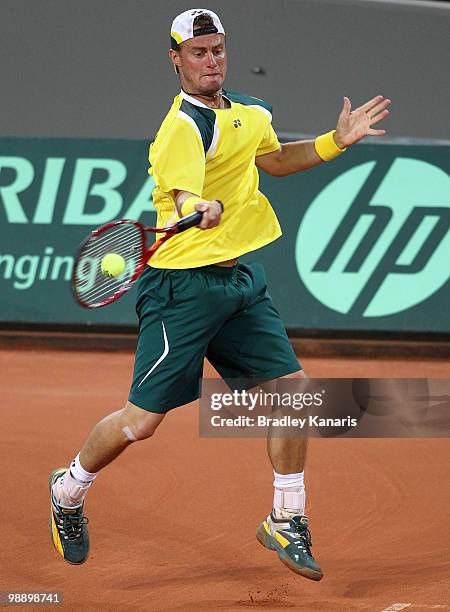 Lleyton Hewitt of Australia plays a forehand during his match against Tatsuma Ito of Japan during the match between Australia and Japan on day one of...