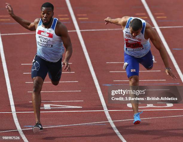 Nethaneel Mitchell-Blake of Great Britain beats Adam Gemili of Great Britain during the men's 200m final during Day Two of the Muller British...