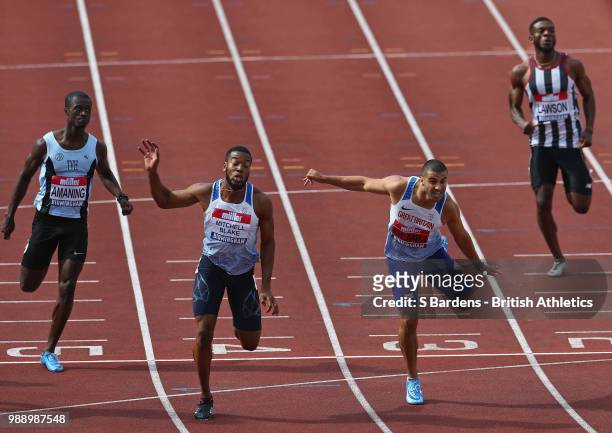 Nethaneel Mitchell-Blake of Great Britain beats Adam Gemili of Great Britain during the men's 200m final during Day Two of the Muller British...