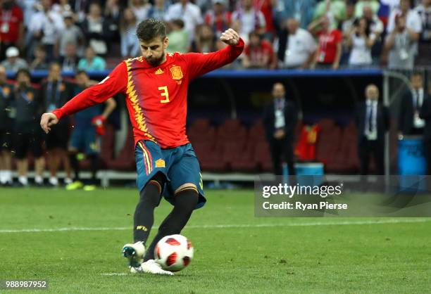 Gerard Pique of Spain scores his team's second penalty in the penalty shoot out during the 2018 FIFA World Cup Russia Round of 16 match between Spain...
