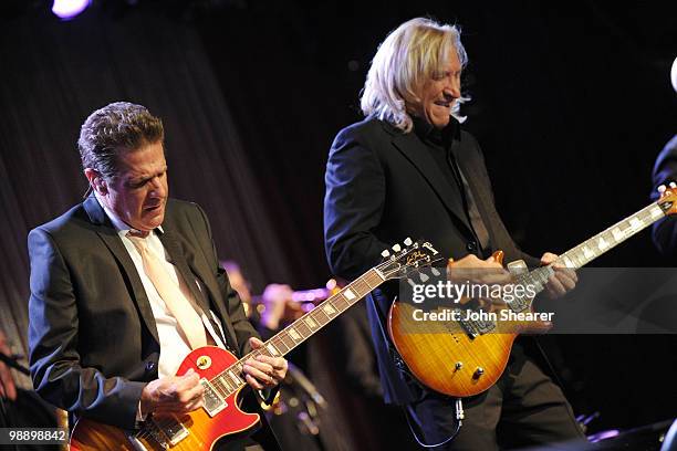 Musicians Glenn Frey and Joe Walsh of the Eagles perform at the Lupus LA Orange Ball on May 6, 2010 in Beverly Hills, California.