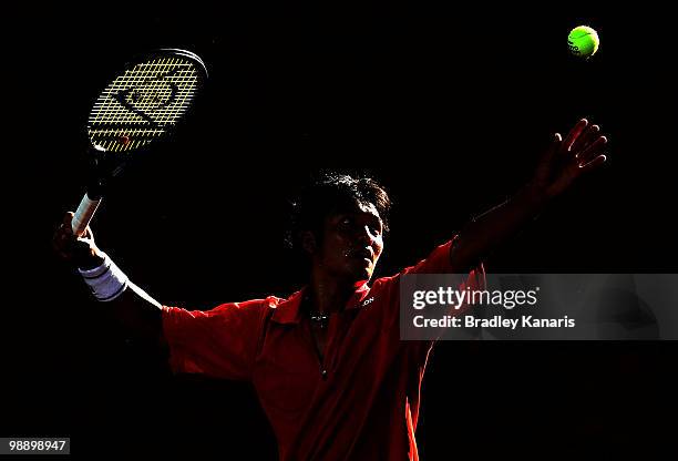 Tatsuma Ito of Japan serves during his match against Lleyton Hewitt of Australia during the match between Australia and Japan on day one of the Davis...