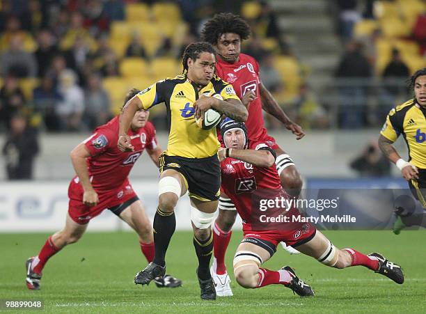 Rodney So'oialo of the Hurricanes is tackled by Van Humphries of the Reds during the round 13 Super 14 match between the Hurricanes and the Reds at...