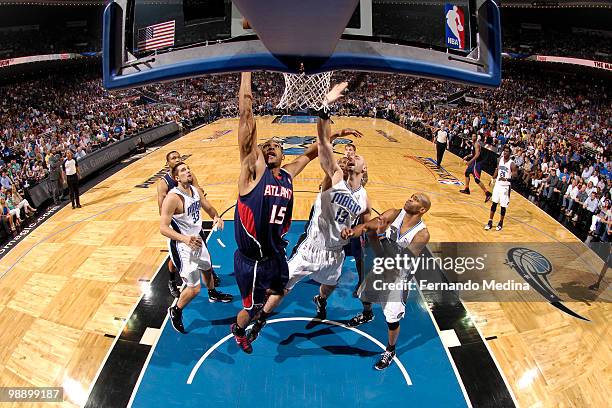 Al Horford of the Atlanta Hawks shoots against Marcin Gortat of the Orlando Magic in Game Two of the Eastern Conference Semifinals during the 2010...