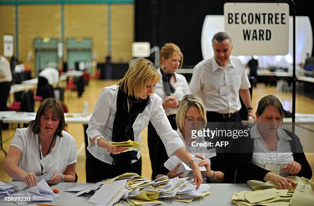 Tellers count ballot papers in the Barking and Dagenham constituencies in east London, on May 6, 2010. Voters plunged Britain into limbo Friday as...