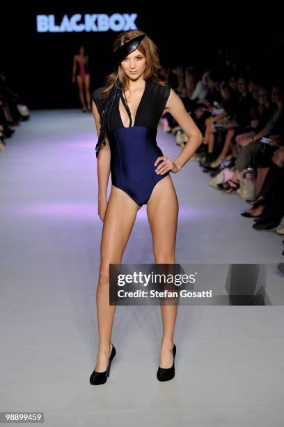 Model Jasmine Yarbrough showcases designs on the catwalk by Blackbox Apparel during the Swimwear Fashion Week At RAFW collection show on the fifth...