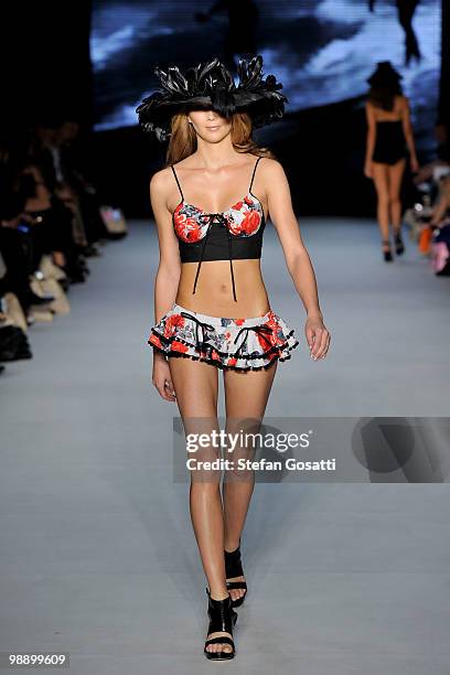 Model Jasmine Yarbrough showcases designs from the Karen Neilsen Collection on the catwalk during the Swimwear Fashion Week At RAFW collection show...