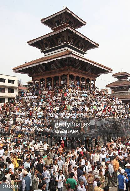 Nepalese local residents attend a peace rally in Kathmandu on May 7 calling on the coalition government and the opposition Maoists to resolve their...