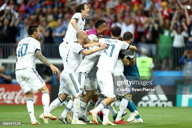 Akinfeev of Russia is celebrated by team mates following the penalty shoot out during the 2018 FIFA World Cup Russia Round of 16 match between Spain...