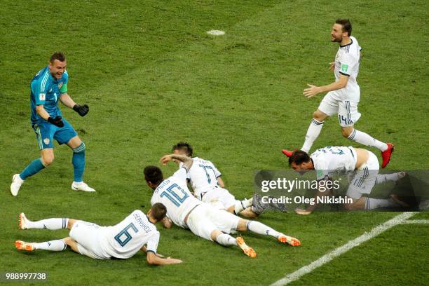 Russia players celebrate following their sides victory in the penalty shoot out during the 2018 FIFA World Cup Russia Round of 16 match between Spain...