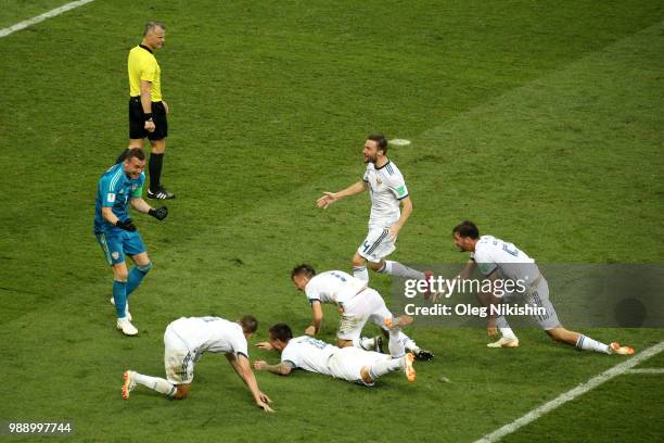 Russia players celebrate following their sides victory in the penalty shoot out during the 2018 FIFA World Cup Russia Round of 16 match between Spain...