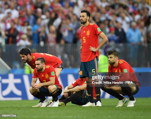 Spain players look dejected during penalty shoot out following the 2018 FIFA World Cup Russia Round of 16 match between Spain and Russia at Luzhniki...