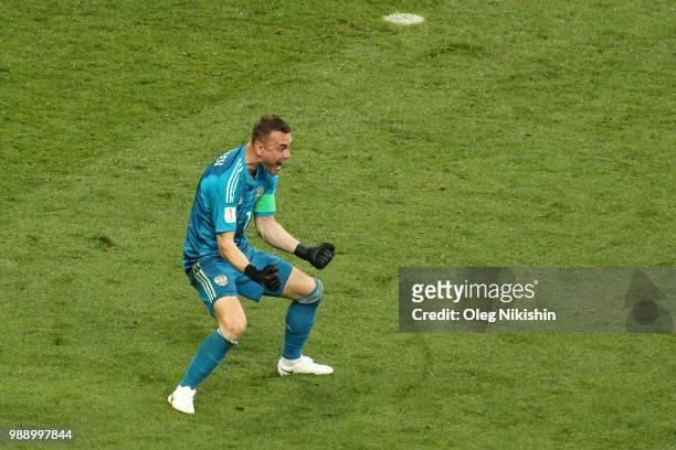 Igor Akinfeev of Russia celebrates his team's victory following the 2018 FIFA World Cup Russia Round of 16 match between Spain and Russia at Luzhniki...