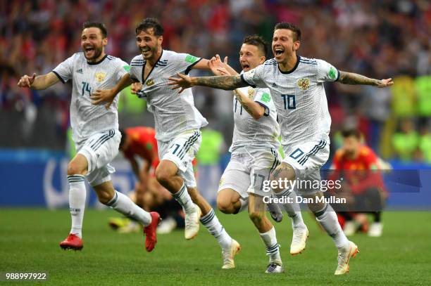 Russia players celebrate following their sides victory in a penalty shoot out during the 2018 FIFA World Cup Russia Round of 16 match between Spain...