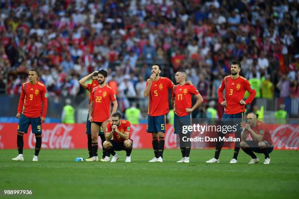 Spain players look dejected during penalty shoot out following the 2018 FIFA World Cup Russia Round of 16 match between Spain and Russia at Luzhniki...