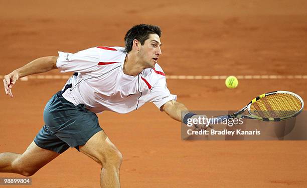 Carsten Ball of Australia plays a forehand volley during his match against Yuichi Sugita of Japan during the match between Australia and Japan on day...