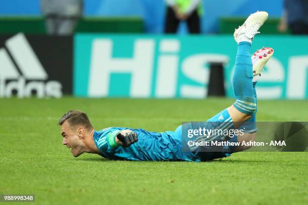 Igor Akinfeev of Russia celebrates after his team's victory in a penalty shootout during the 2018 FIFA World Cup Russia Round of 16 match between...