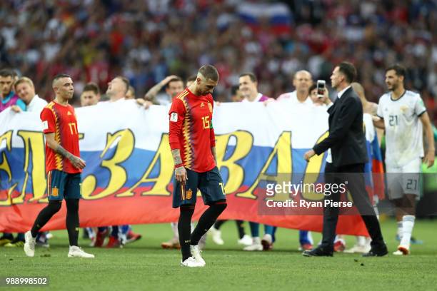 Iago Aspas and Sergio Ramos of Spain look dejected following the 2018 FIFA World Cup Russia Round of 16 match between Spain and Russia at Luzhniki...