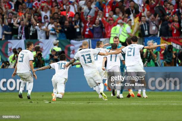 Akinfeev of Russia is celebrated by team mates following the penalty shoot out during the 2018 FIFA World Cup Russia Round of 16 match between Spain...